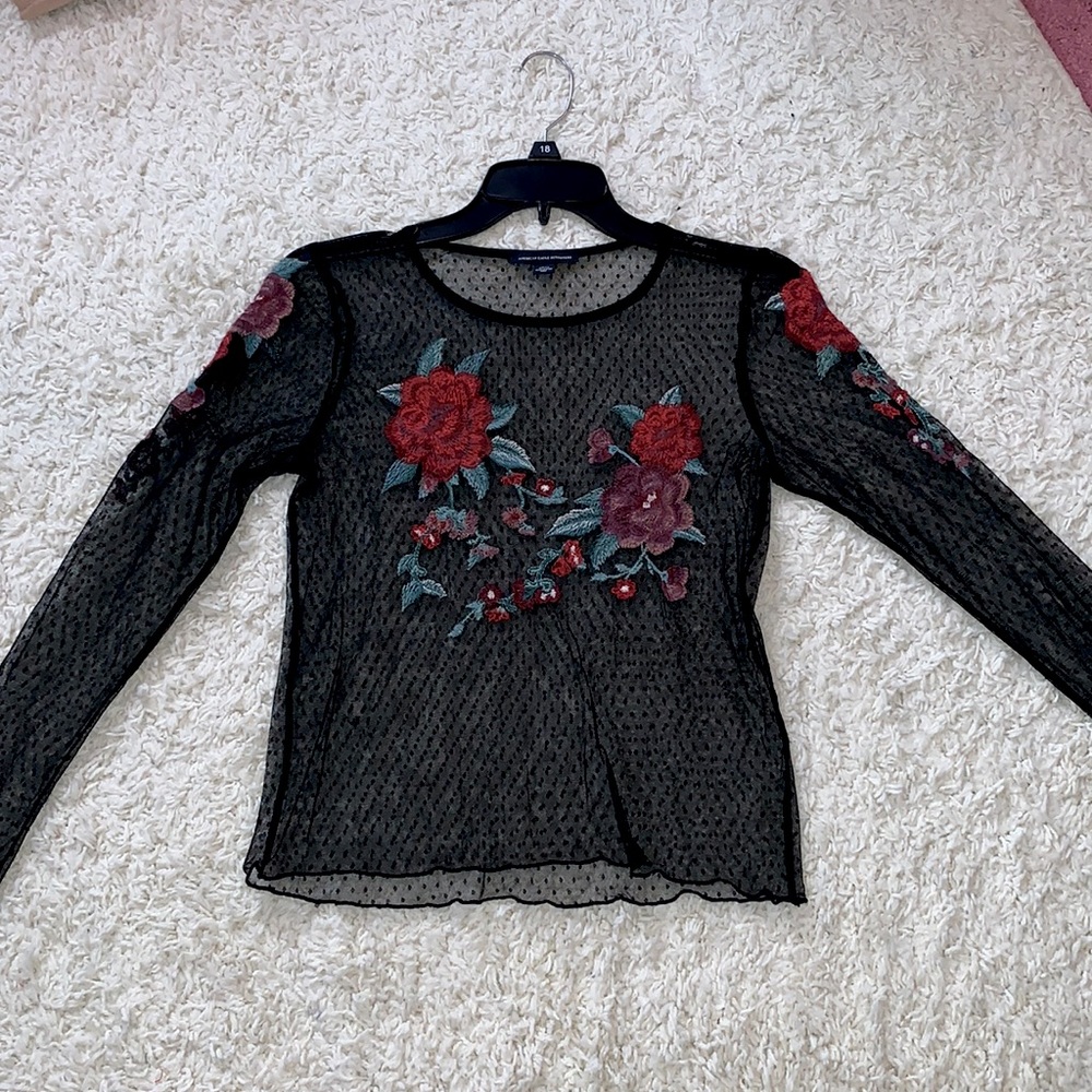 sheer top with flowers on the front and sleeves